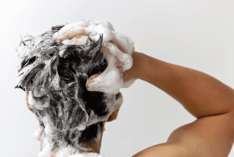 washing hair with hair thickenning shampoo