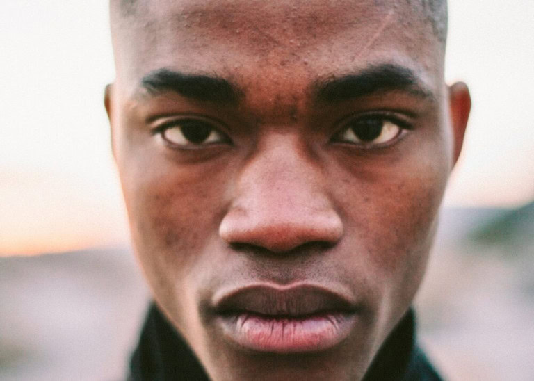 Man in turtle neck with full lips