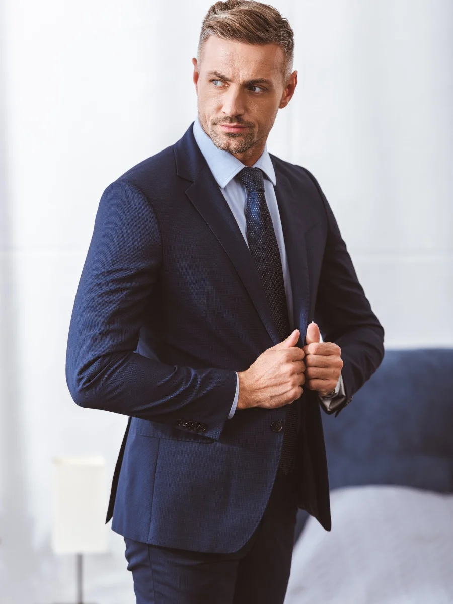 Handsome man in navy blue suit and tie
