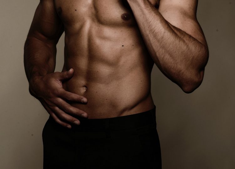 man with a six pack wearing black underwear