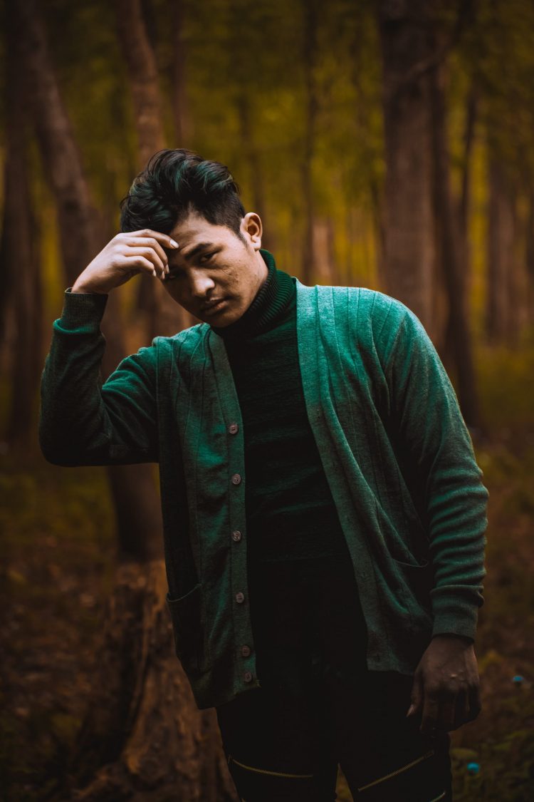 man in green cardigan