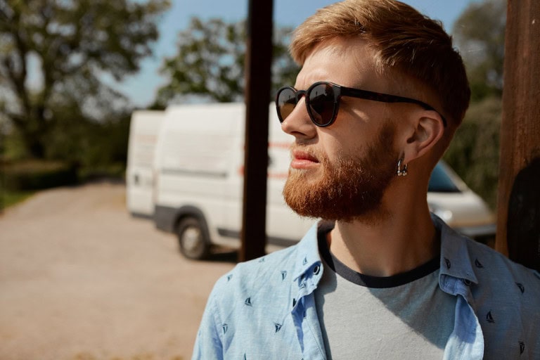 man wearing cool earrings
