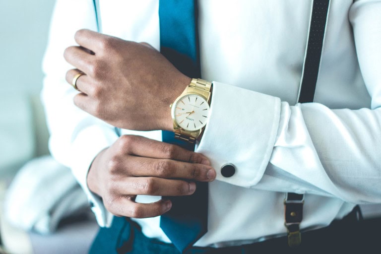 Man wearing classic gold watch