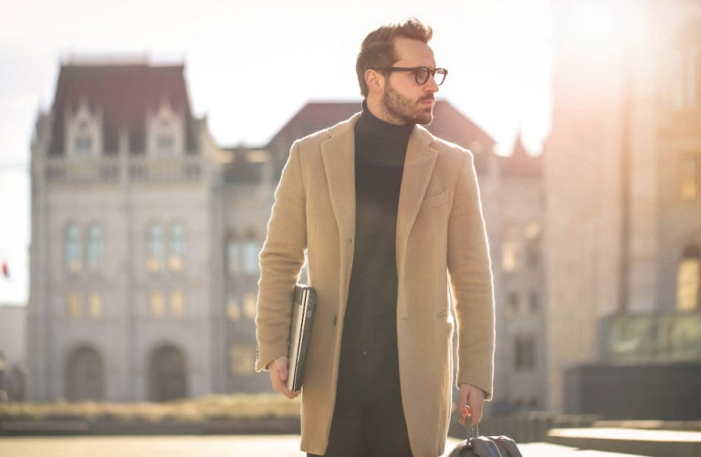 Professional wearing classic tan overcoat