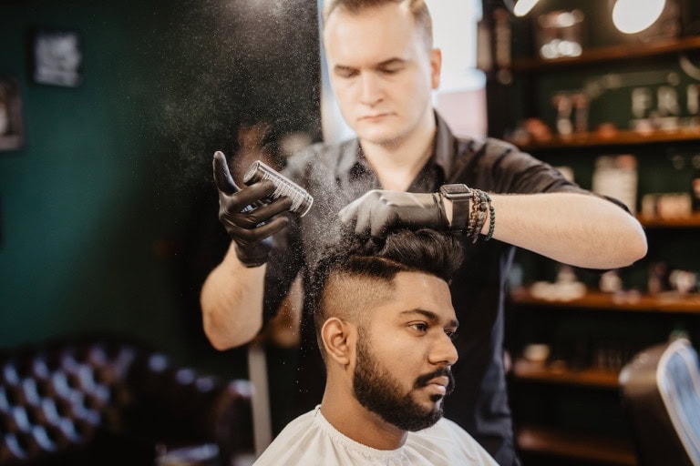 Barber applying hair powder