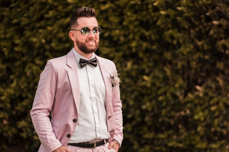 man in pink suit