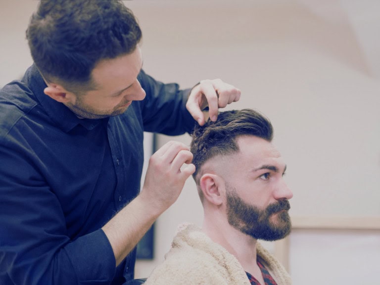 Man getting a perfect burst fade hairstyle
