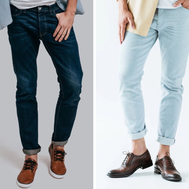 Side-by-side comparison of two men wearing jeans: the left wears dark blue jeans with brown casual shoes, and the right wears light blue jeans with brown dress shoes. Both have their hands resting near their pockets.