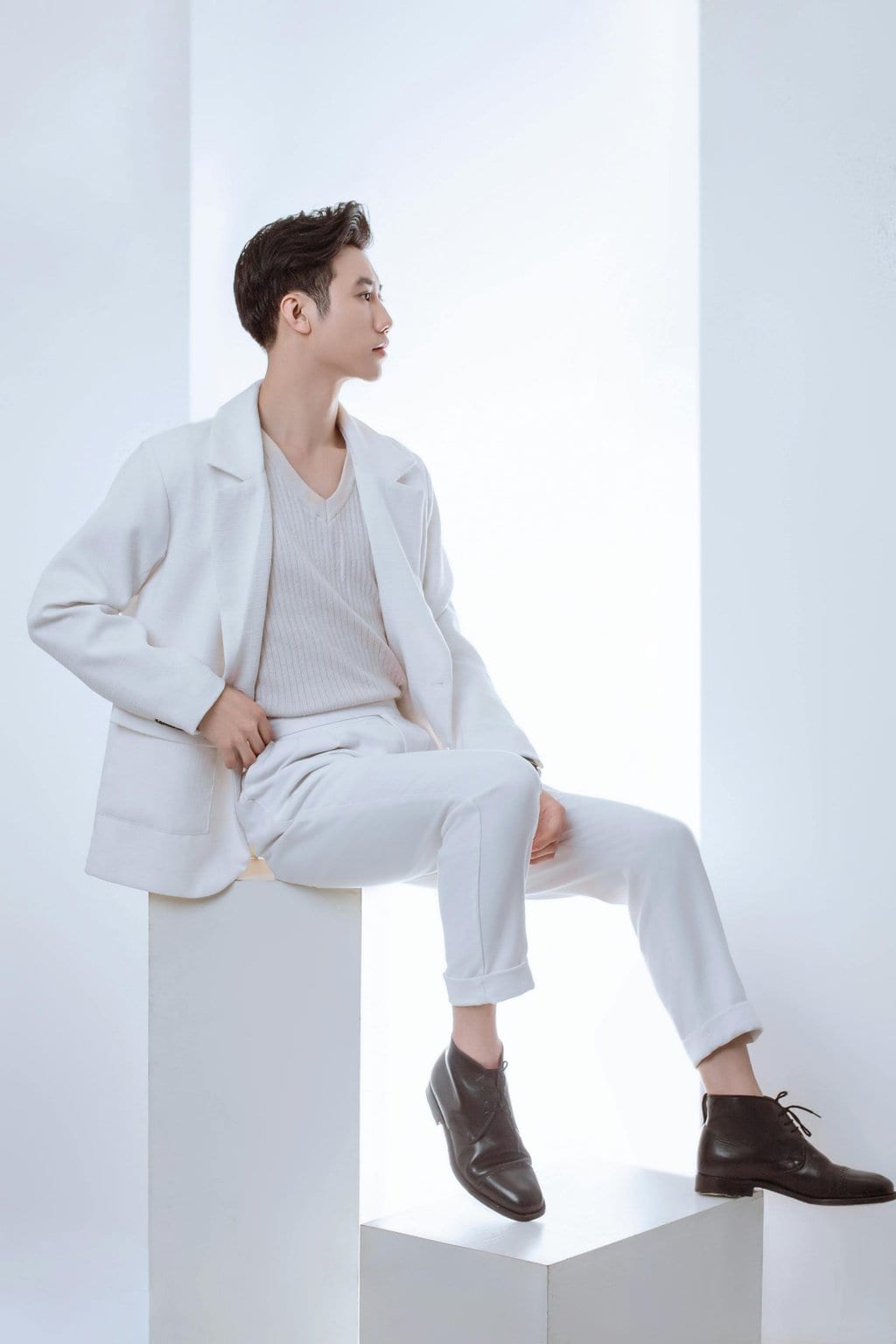 man in all white suit and shirt