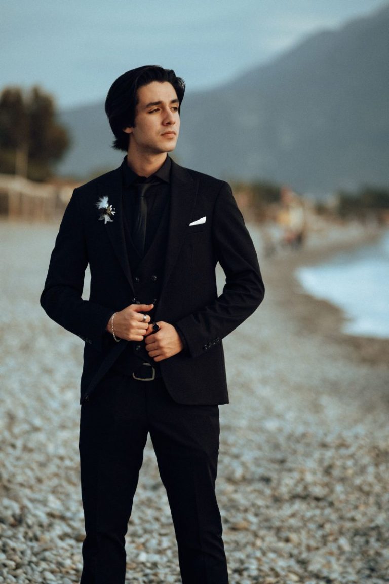 Sophisticated man in a black suit at a formal event