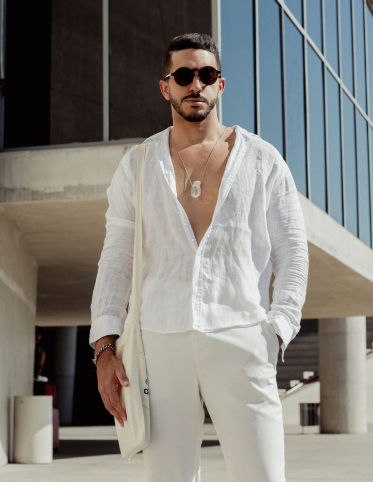 Man in a white outfit and sunglasses, Riviera coastal style