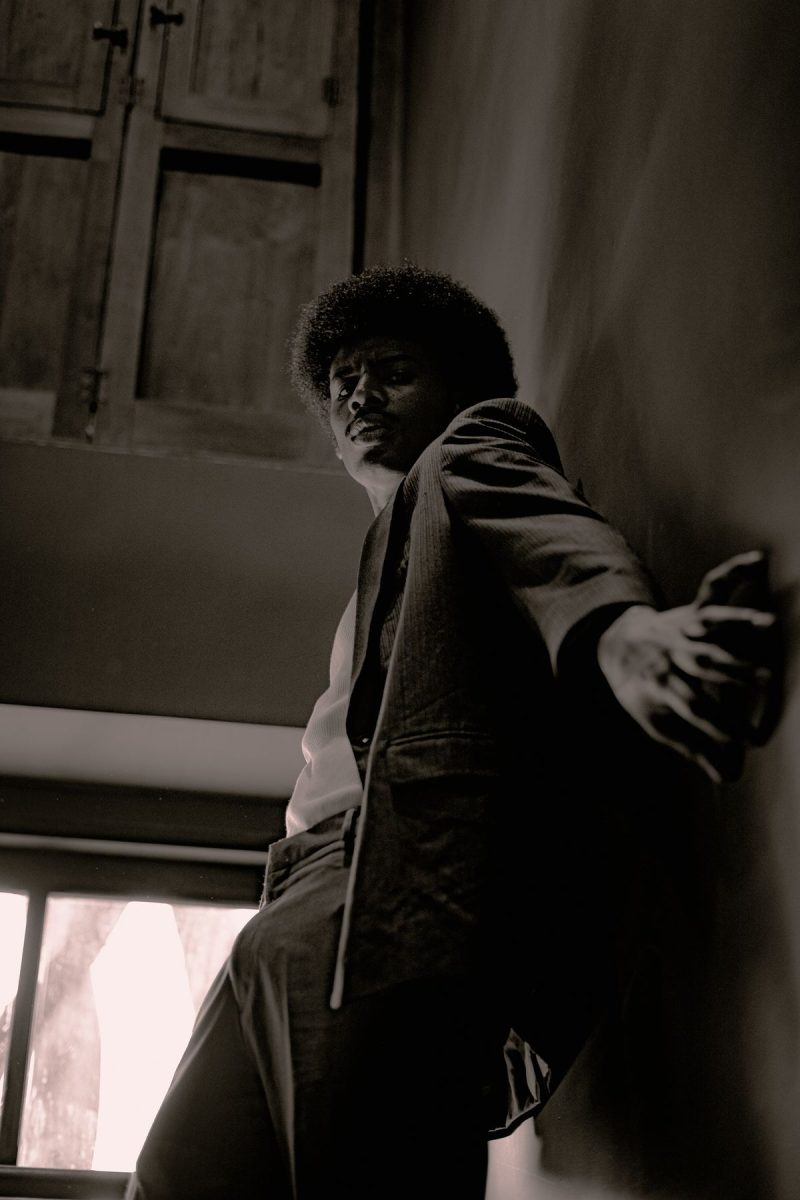 Black and white portrait of a man in dramatic low light
