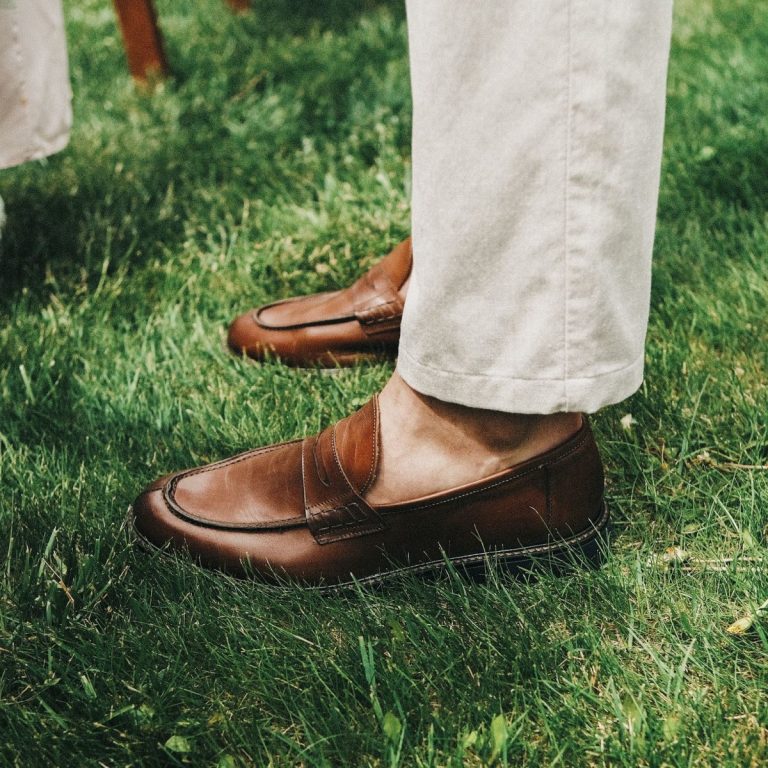 Man wearing brown leather loafers without visible socks
