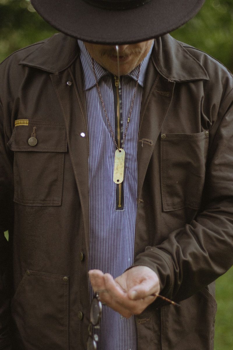 Man in rugged heritage workwear photographed outdoors in natural light